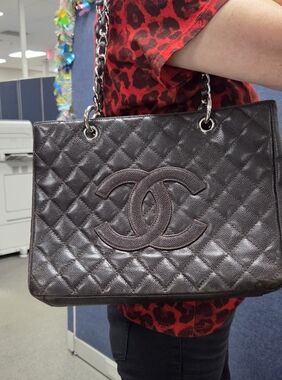 CHANEL Dark Brown GST Quilted Leather Tote with Silver-Tone Chain Handles.